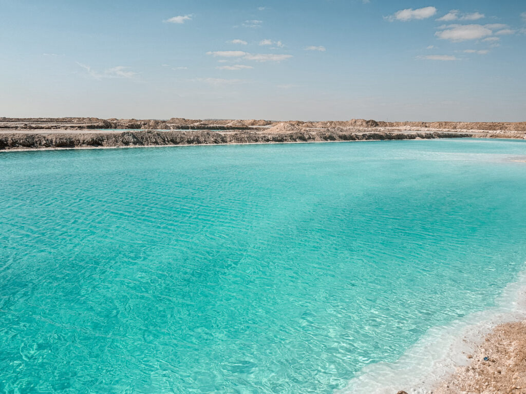 shimmering turquoise salt pools in siwa oasis