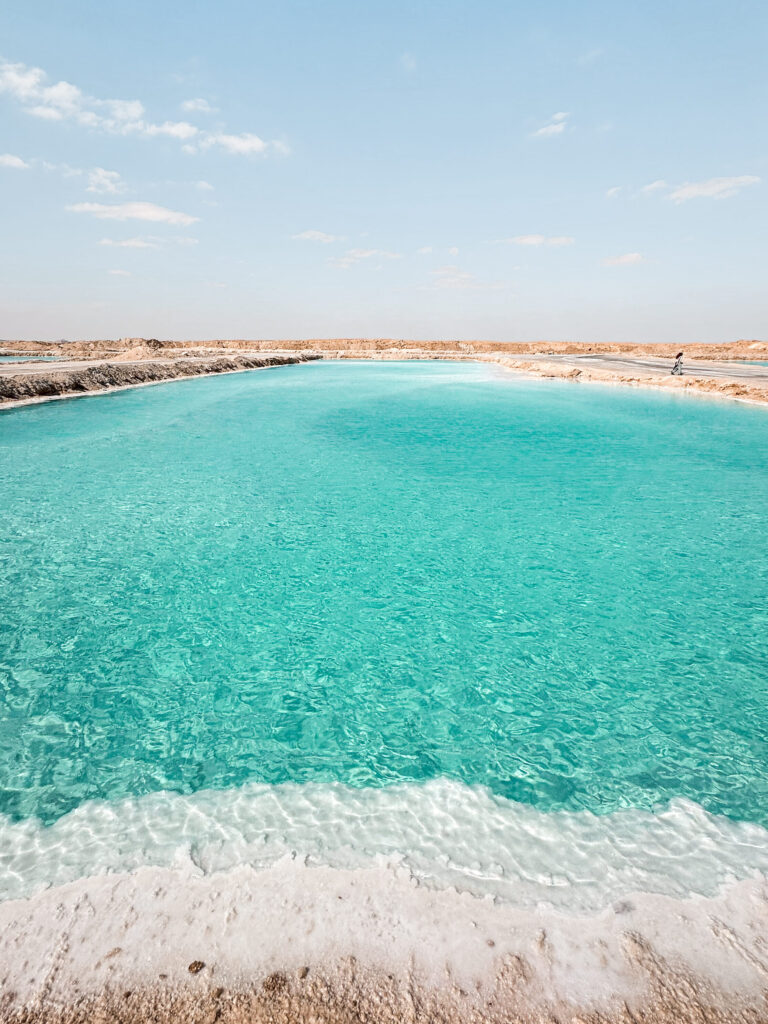 shimmering turquoise salt pools in siwa oasis