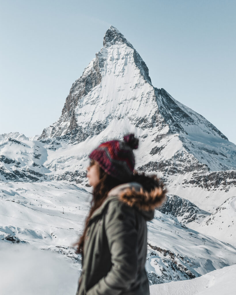 Solo traveller with Matterhorn mountain backdrop in Switzerland
