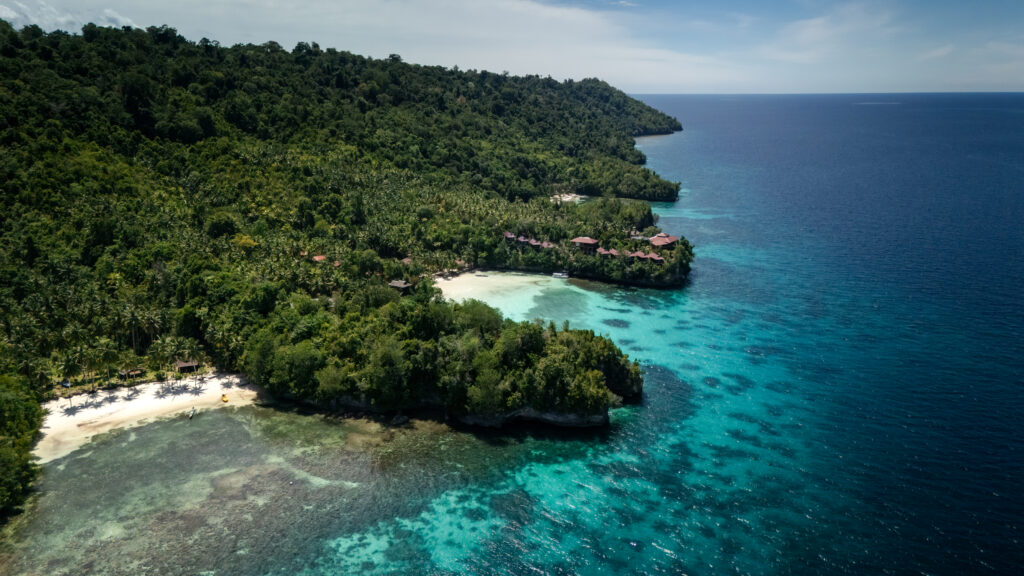 Aerial view of coastline with resorts in Malenge, Togean Islands, Indonesia