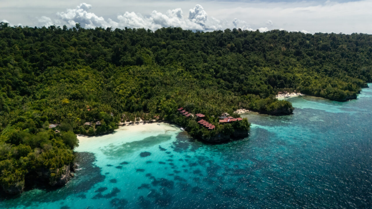 Aerial view of coastline with resorts in Malenge, Togean Islands, Indonesia
