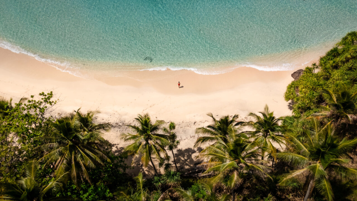 aerial top down of remote hidden beach, sulawesi, indonesia