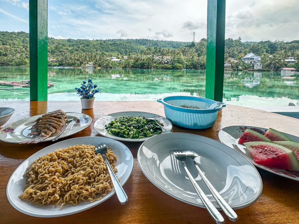 Local Homemade Indonesian food by turquoise water, Peleng Indonesia