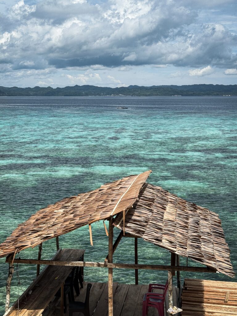 hut by turquoise water, Banggai Laut Indonesia