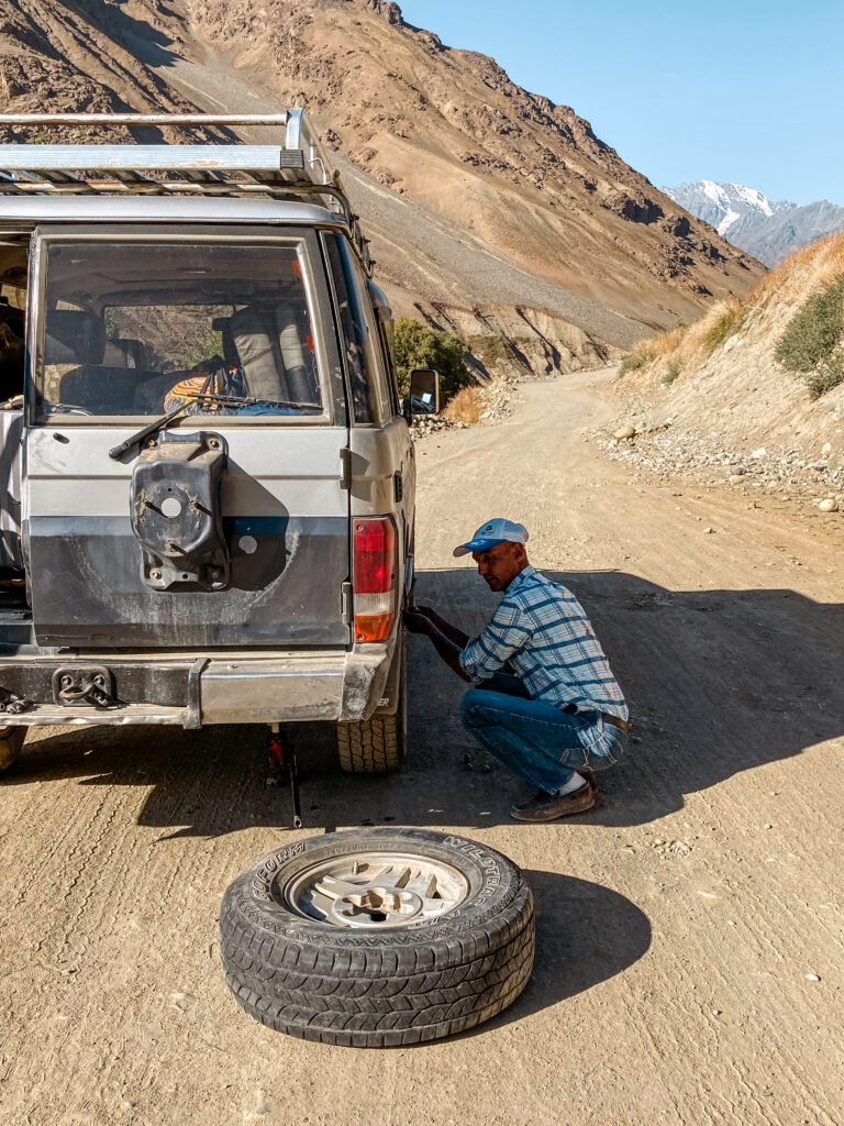 Flat tire on the remote roads towards Shandur Pass, Pakistan