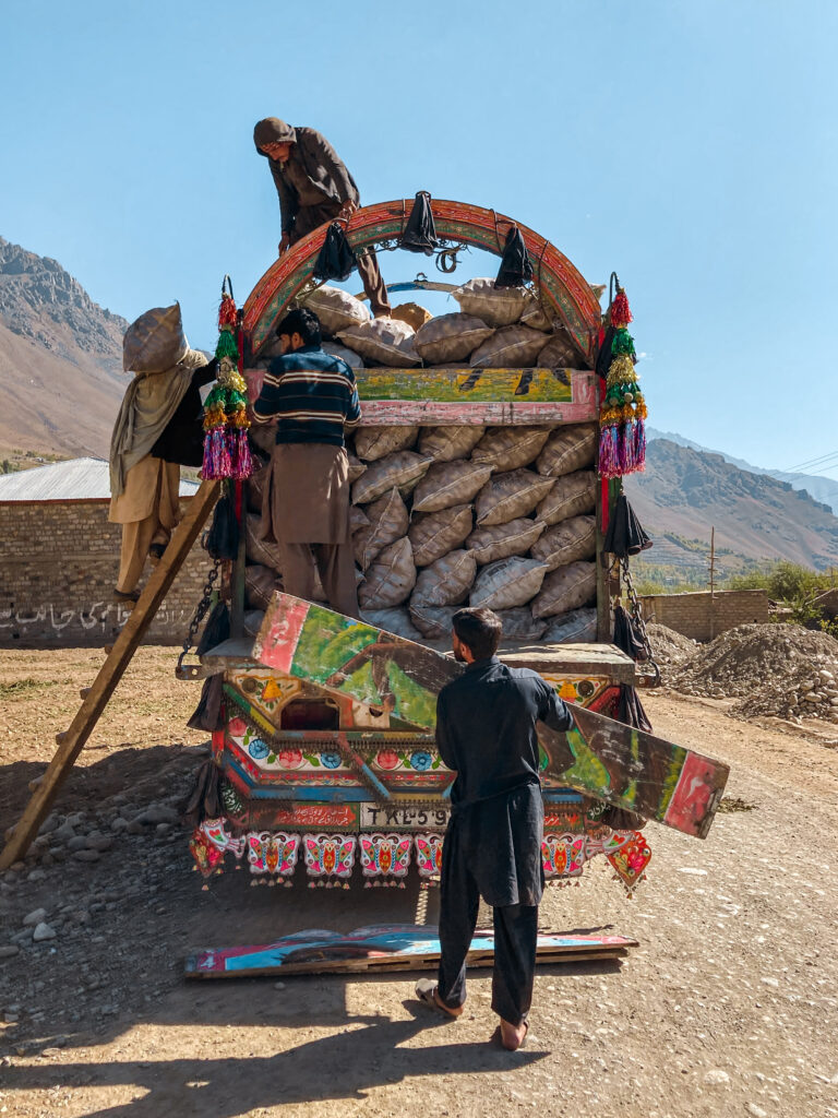 Locals load traditional Pakistani truck with potatoes, KPK Pakistan