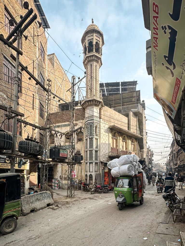 Loaded tuk-tuk in the old city streets in Peshawar, Pakistan