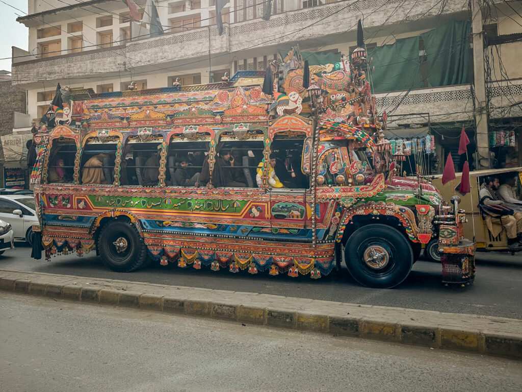 Typical colourfully decorated Pakistani local bus in the old city Peshawar, Pakistan