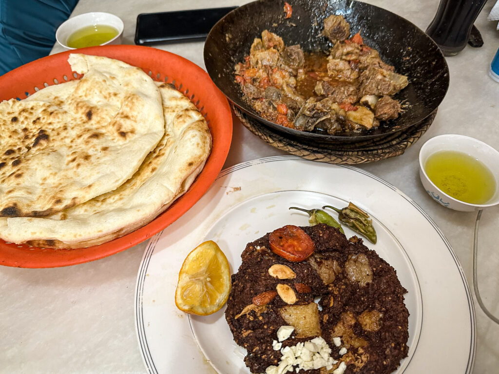Traditional food of Lamb Karahi, chapli kebab and tea in the old city Peshawar, Pakistan