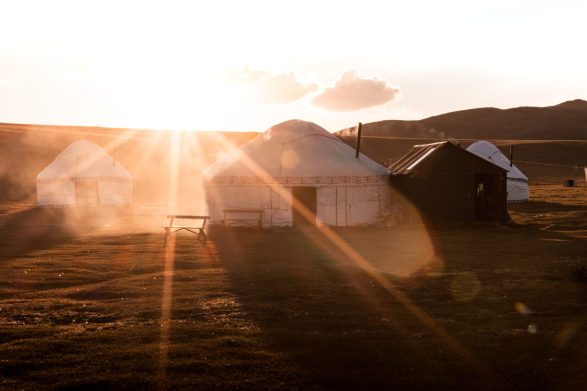 Yurt Camp at sunset, light rays, Kyrgyzstan