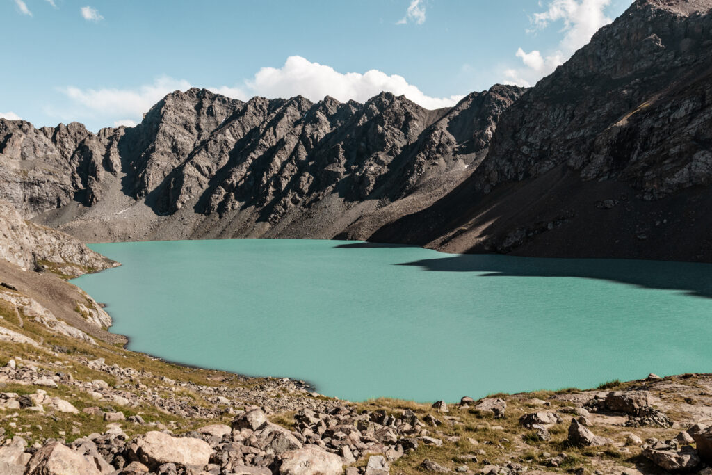 Turquoise water Ala-kul lake on the Ala-Kul trek, Kyrgyzstan