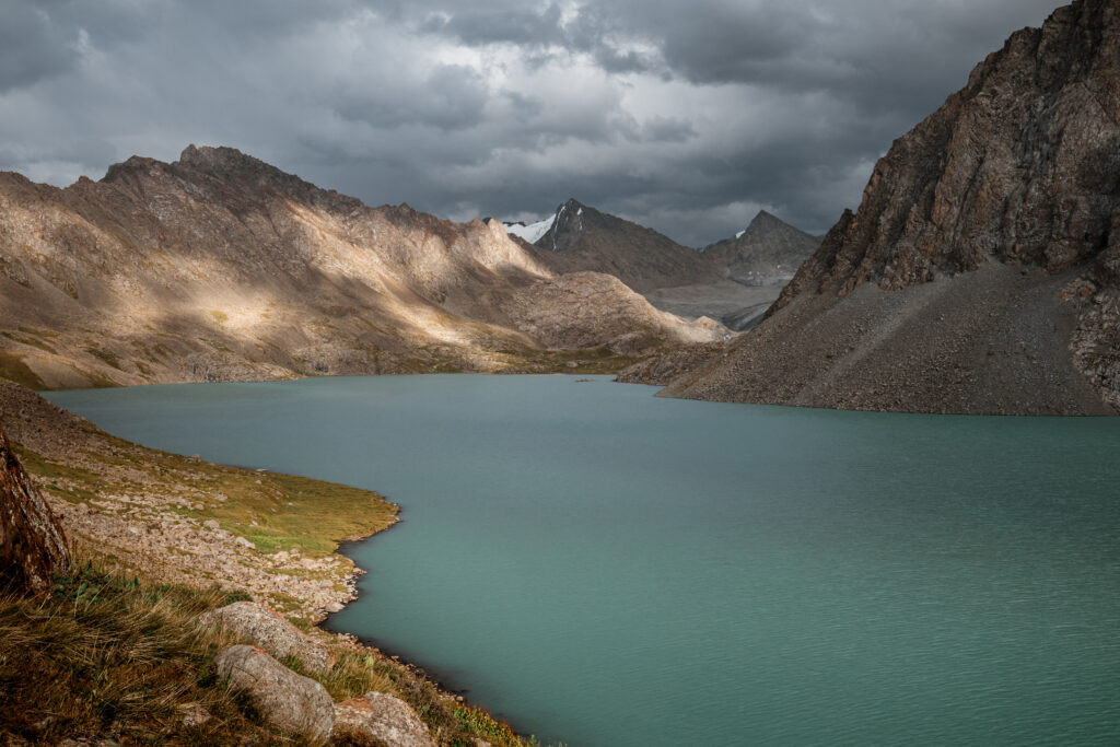 dramatic sunset at Ala-kul lake on the Ala-Kul trek, Kyrgyzstan