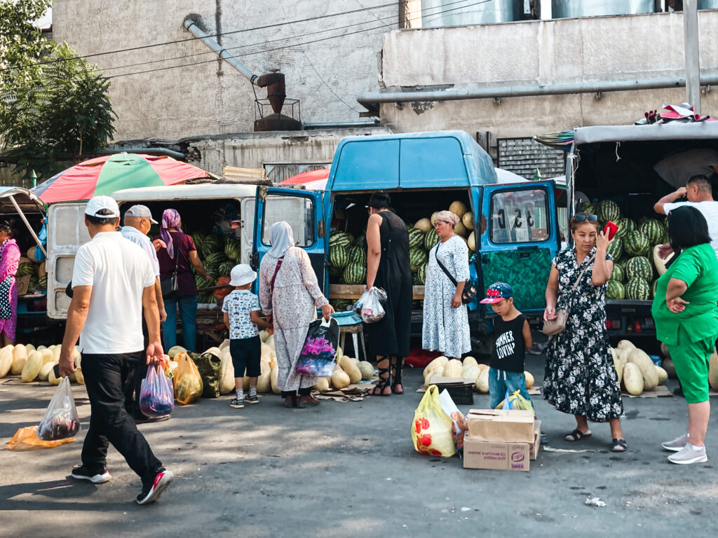 locals buying melons at Osh Bazaar Bishkek, Kyrgyzstan